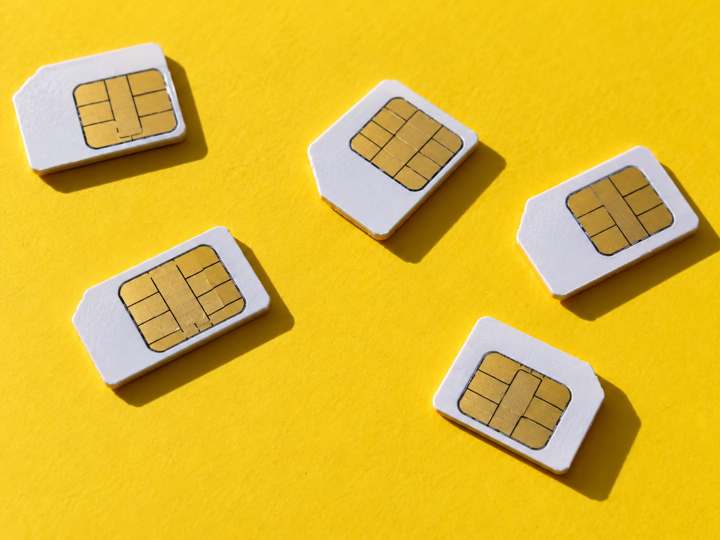 Colorful SIM cards on yellow